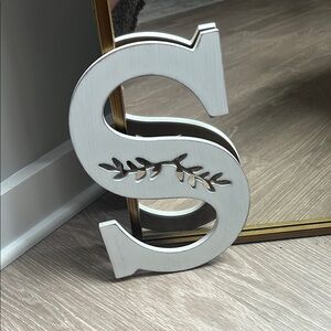 White Decorative Letter S with Leaf Design
